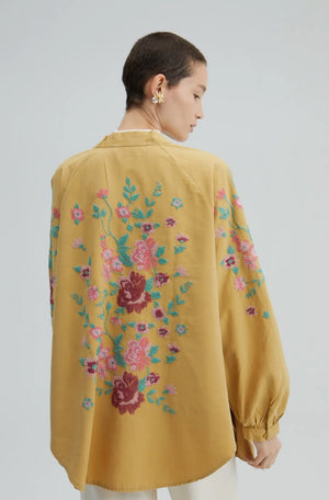 Kimono jacket in a dusty curry with flower embroidery.