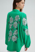 Green kimono jacket with embroidery in a beautiful silver